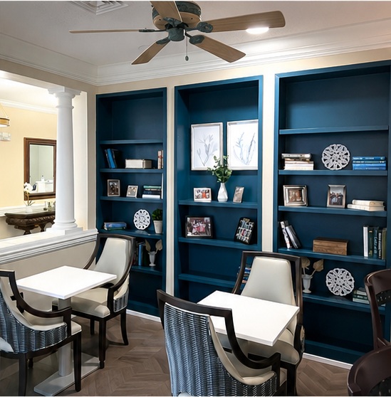 The community lounge with built-in bookshelves